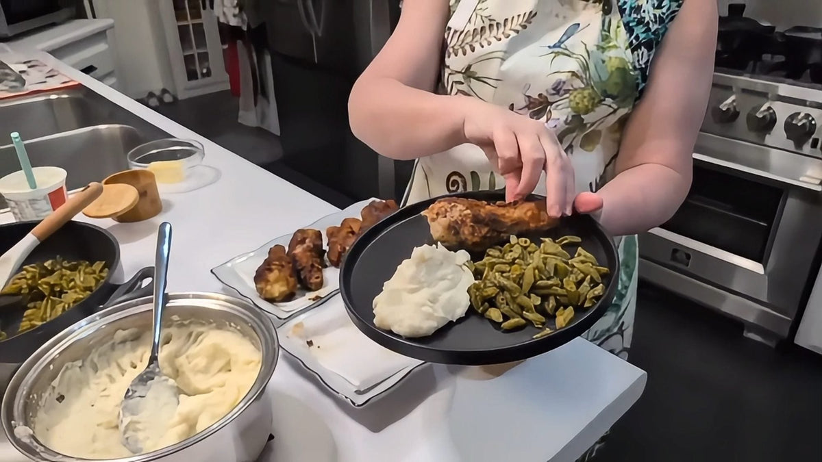 A plated Southern supper - biscuits, greens and gravy